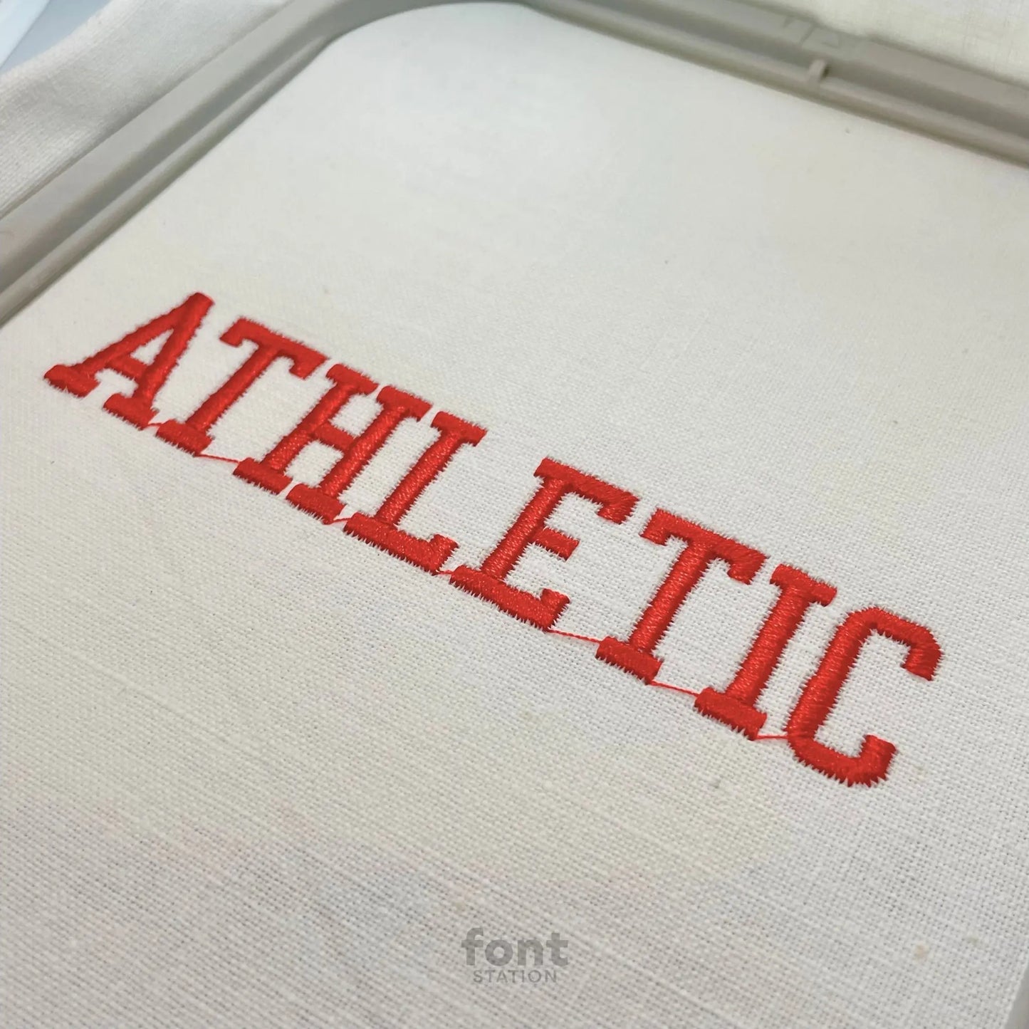 Image showing a word embroidered on textile using the Athletic embroidery font created by FontStation
