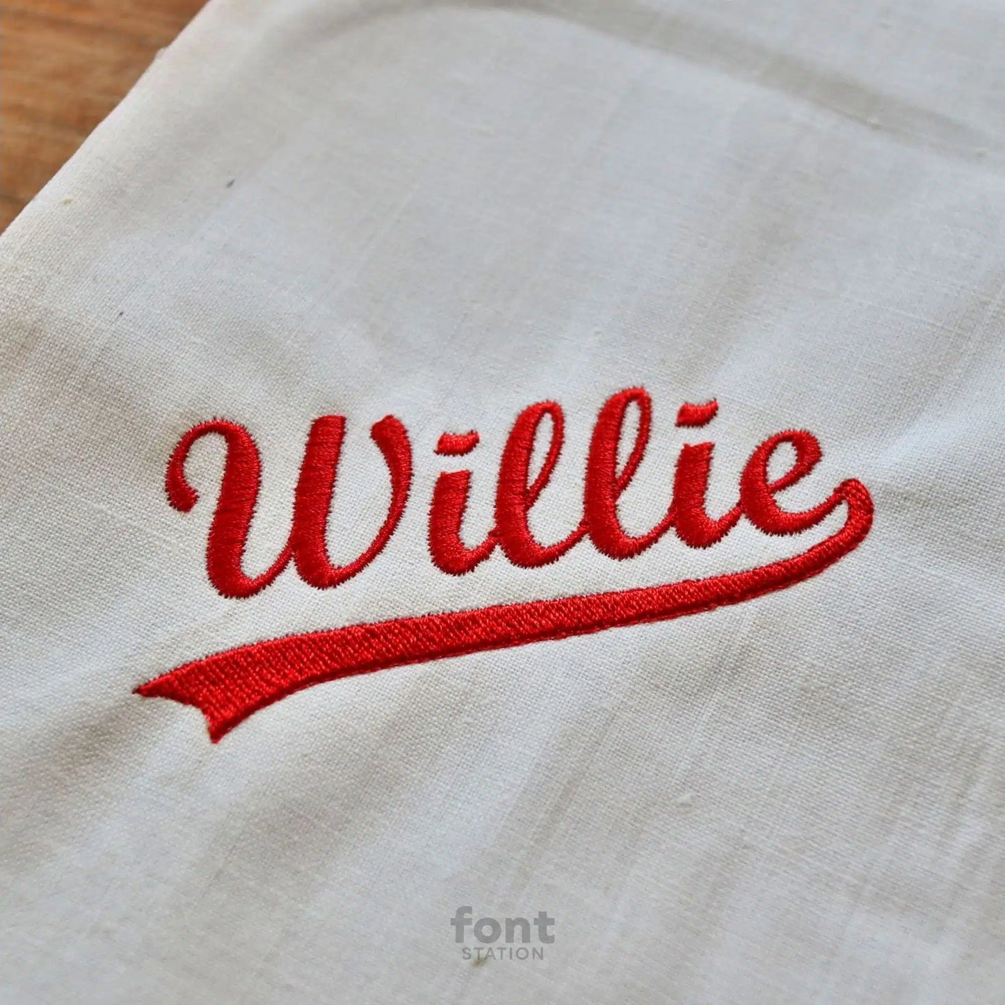 Image showing a word embroidered on textile using the Baseball embroidery font created by FontStation