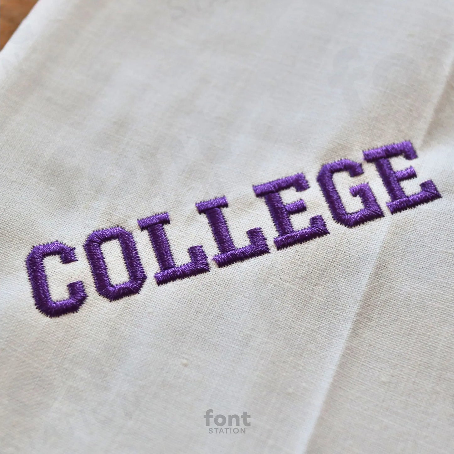 Image showing a word embroidered on textile using the College embroidery font created by FontStation