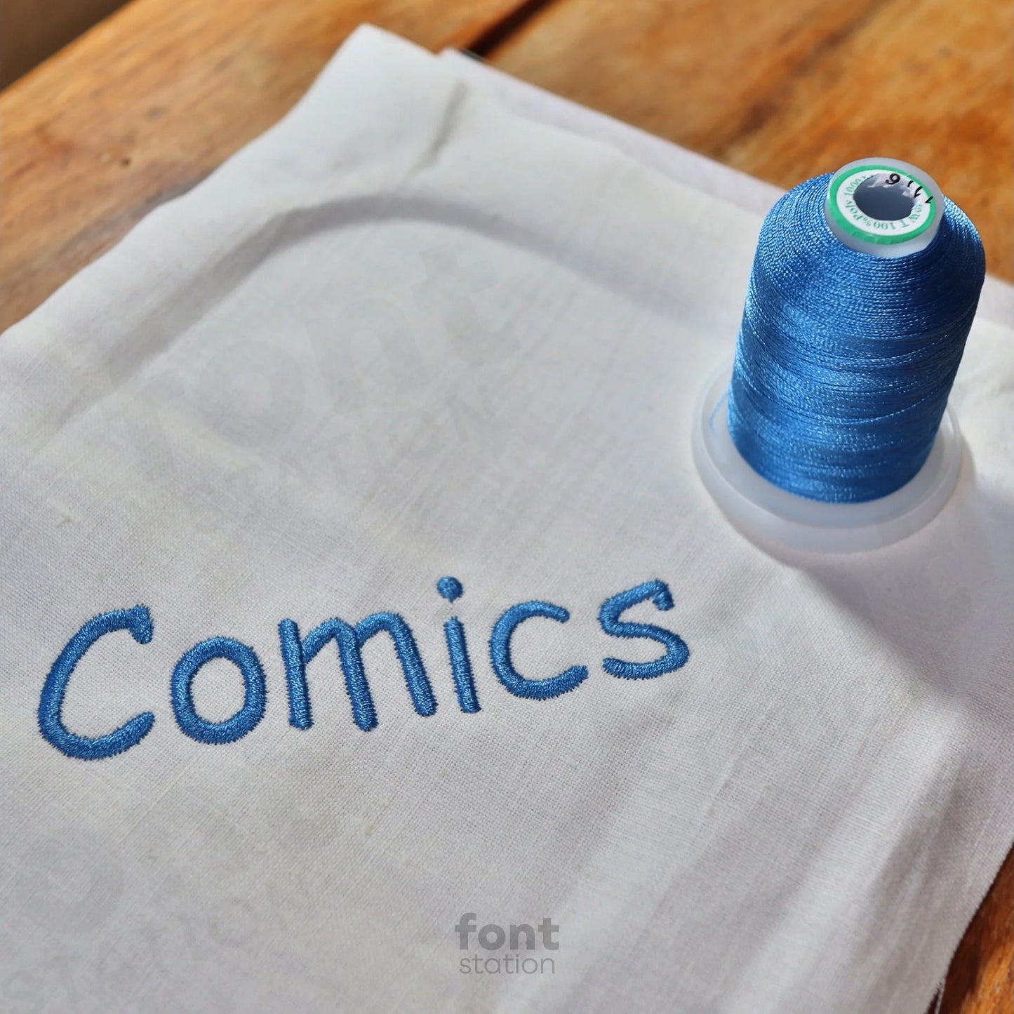 Image showing a word embroidered on textile using the Comic Sans embroidery font created by FontStation