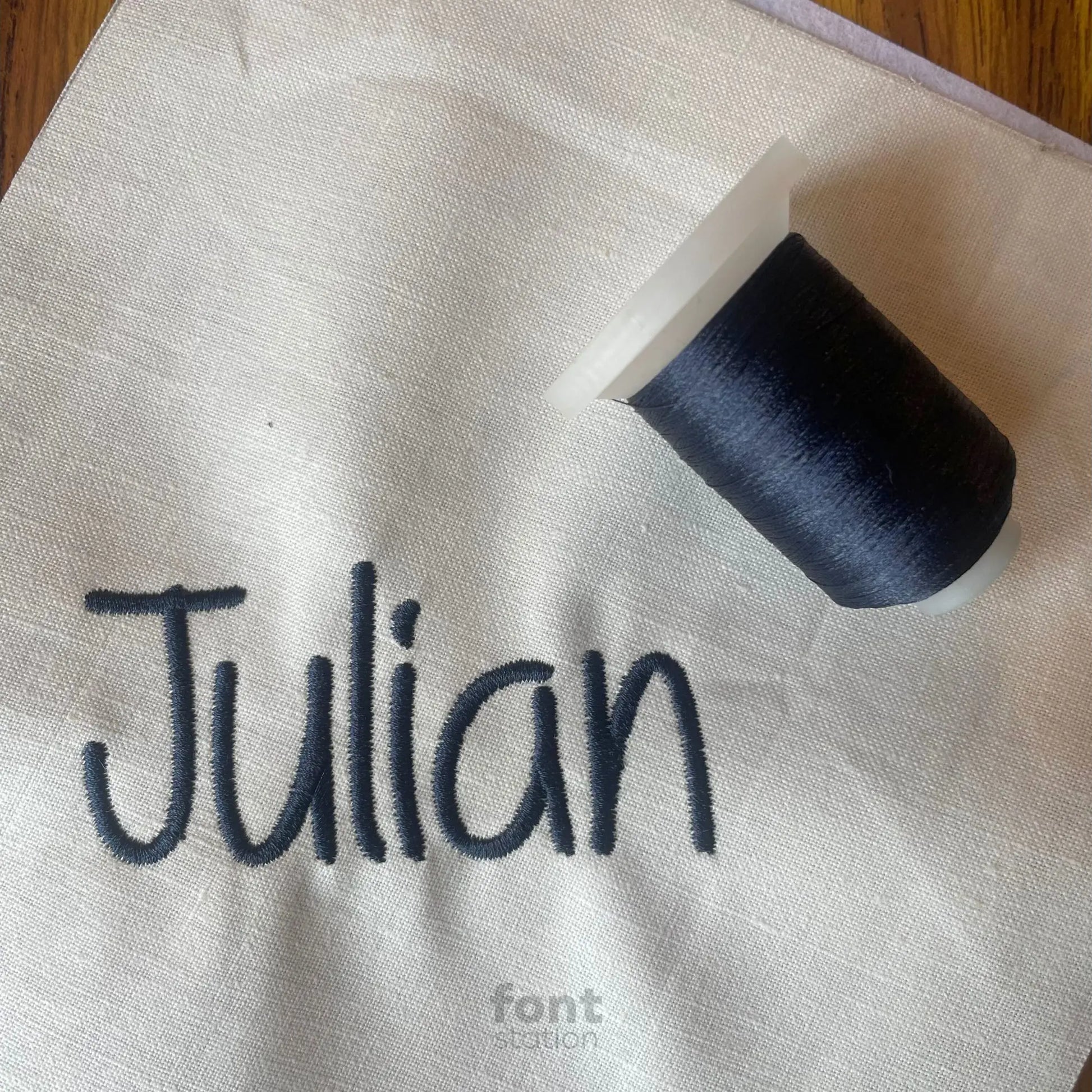 Embroidered letters using the Casual Script embroidery font created by FontStation