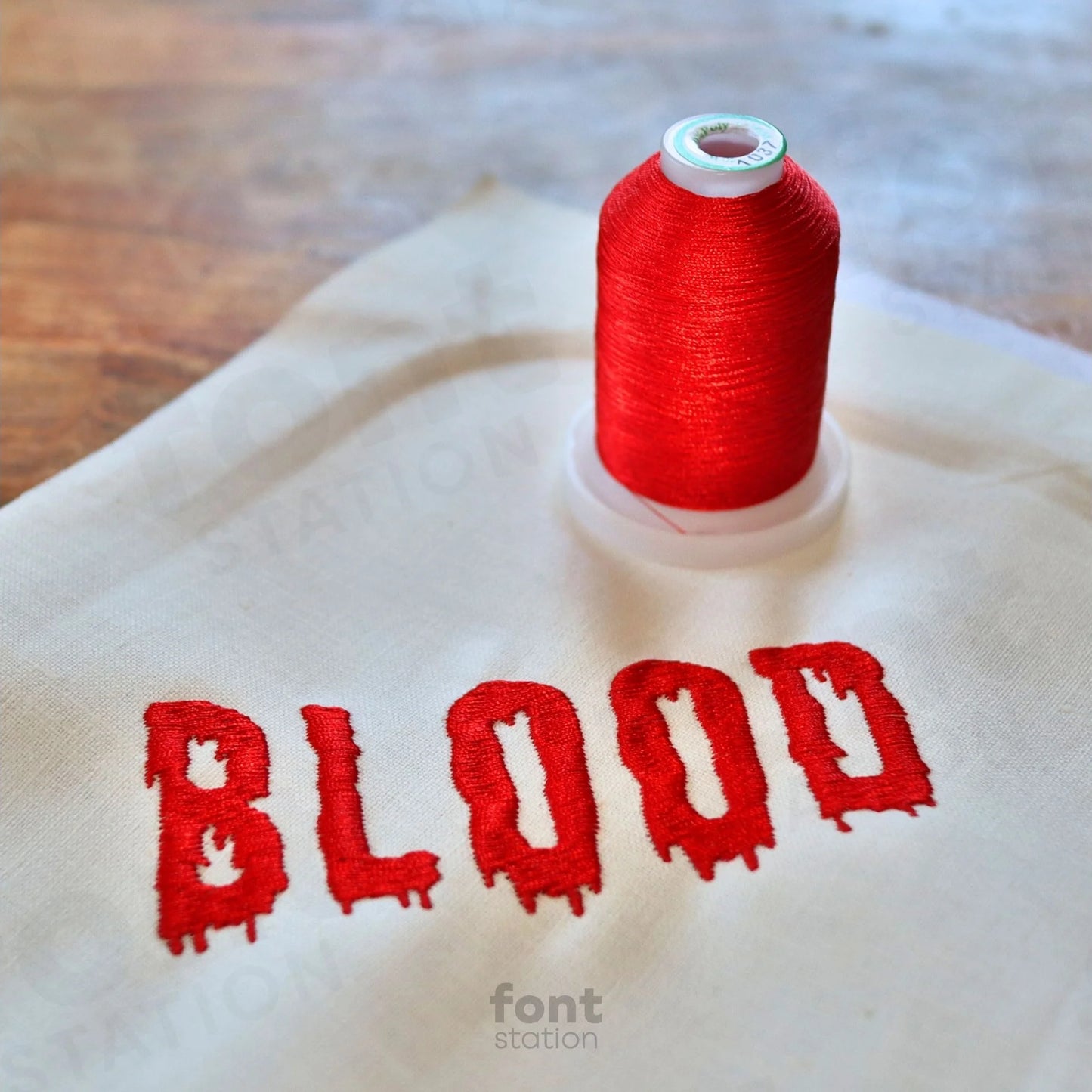 Image showing a word embroidered on textile using the Dripping embroidery font created by FontStation