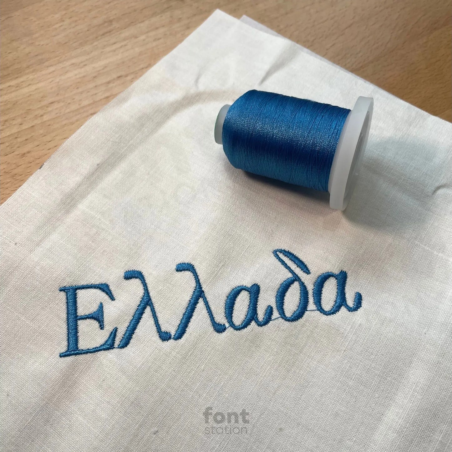 Image showing a word embroidered on textile using the Greek embroidery font created by FontStation