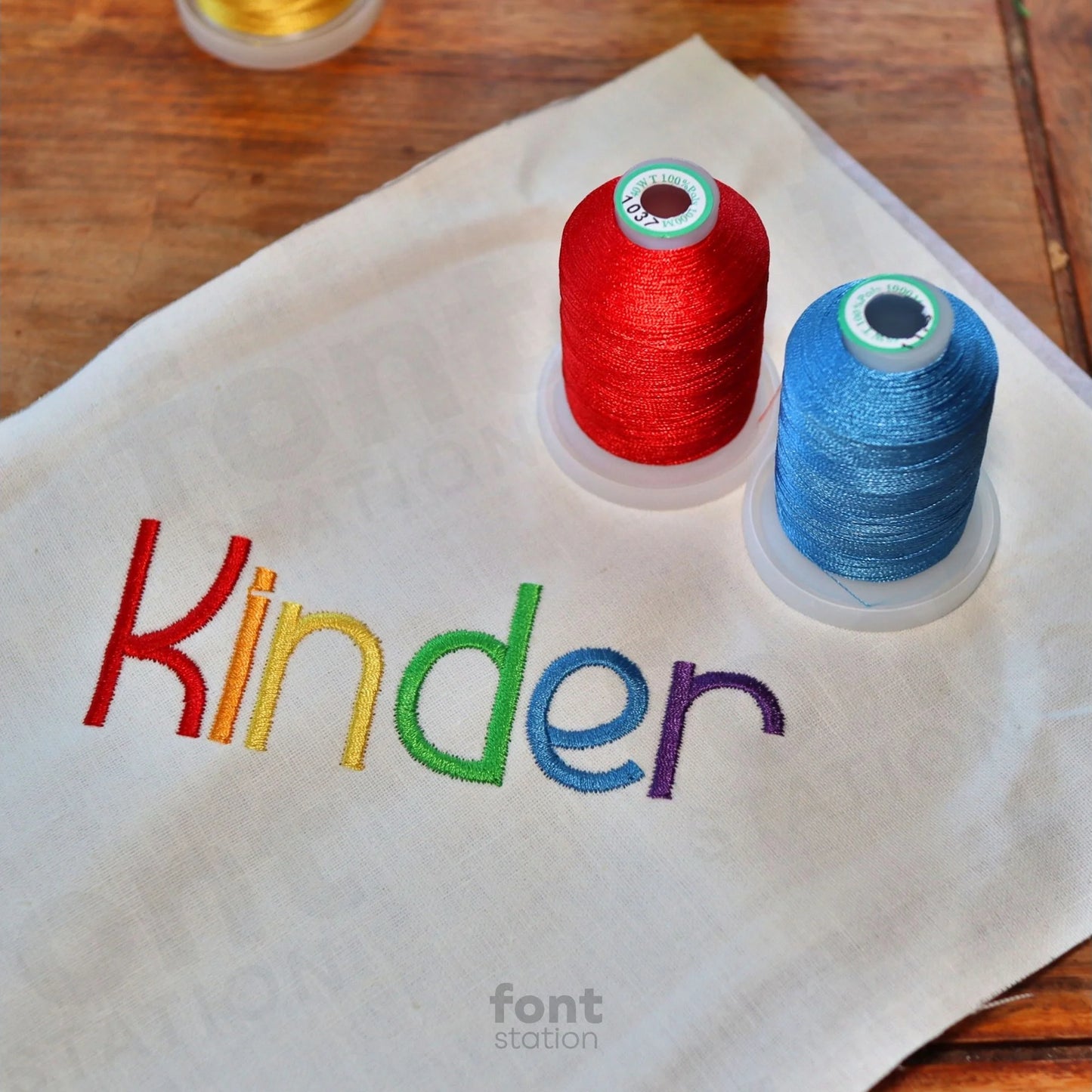 Image showing a word embroidered on textile using the Kindergarten embroidery font created by FontStation