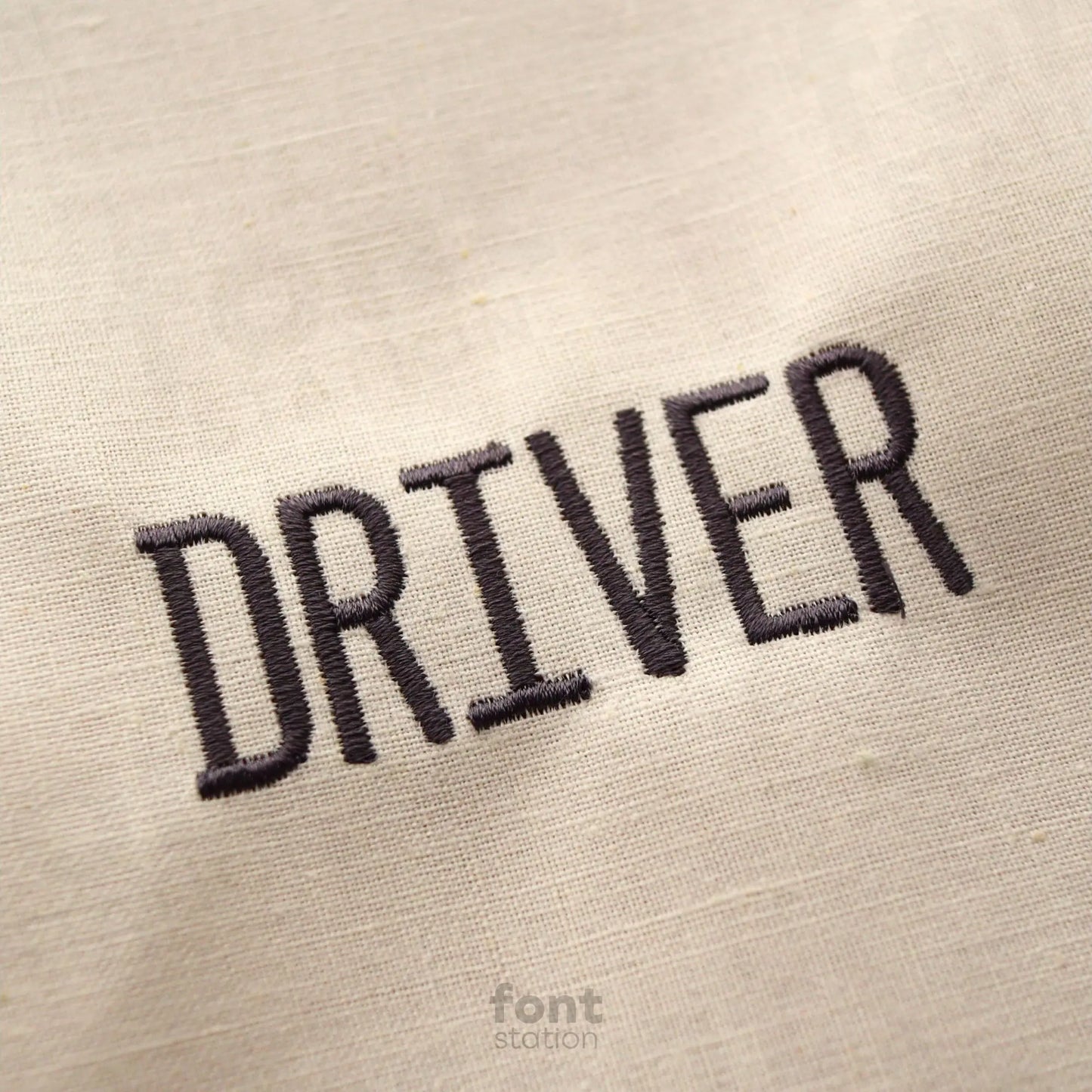 Image showing a word embroidered on textile using the License Plate embroidery font created by FontStation