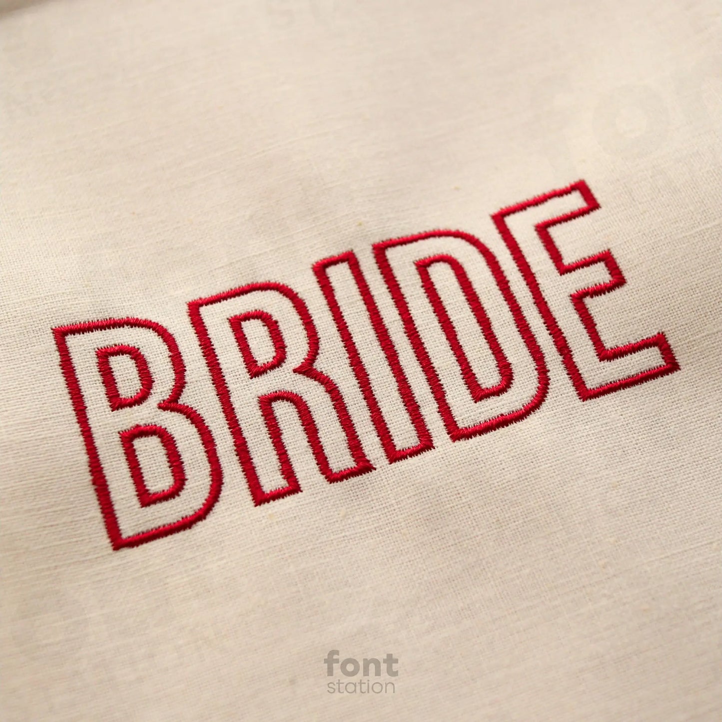 Image showing a word embroidered on textile using the Modern Outline embroidery font created by FontStation