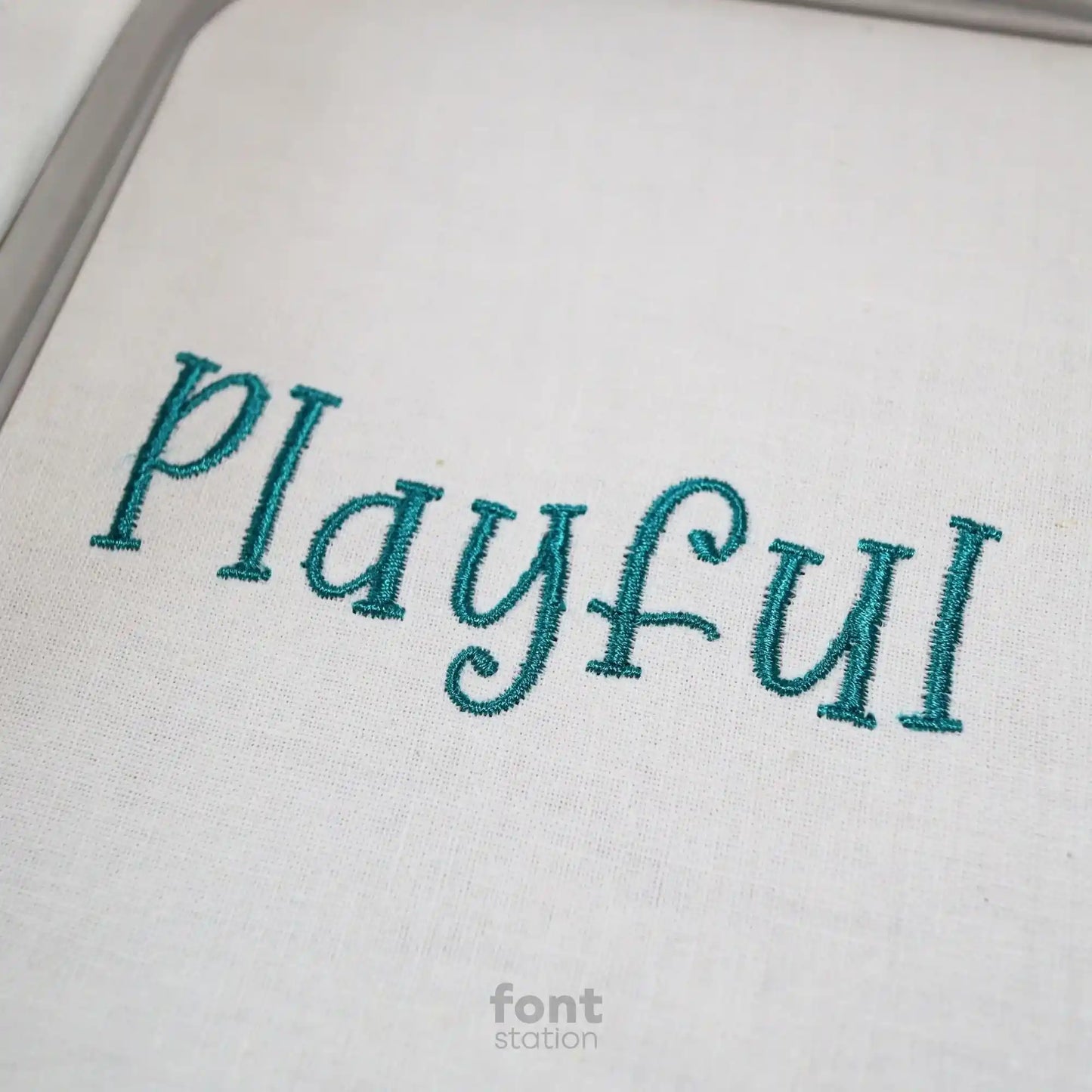 Embroidered letters using the Playful embroidery font created by FontStation
