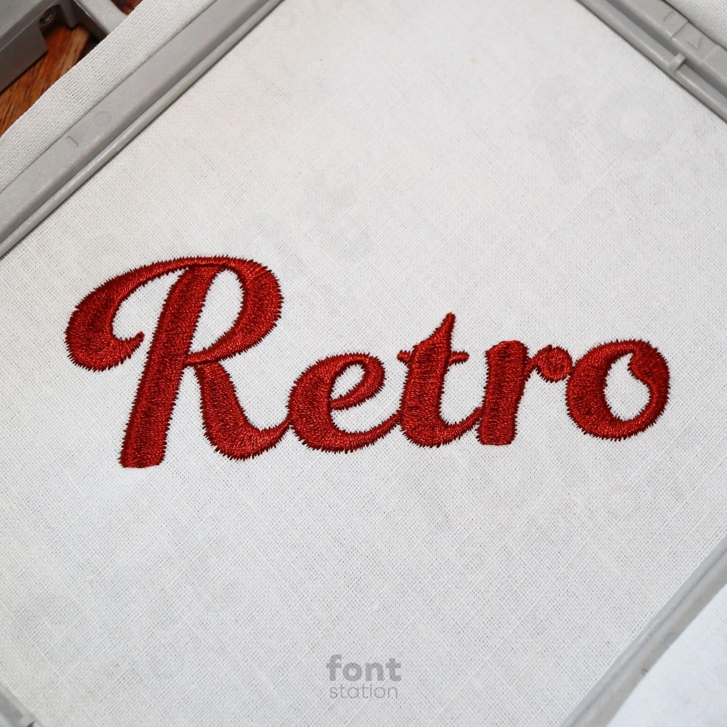 Image showing a word embroidered on textile using the Retro embroidery font created by FontStation