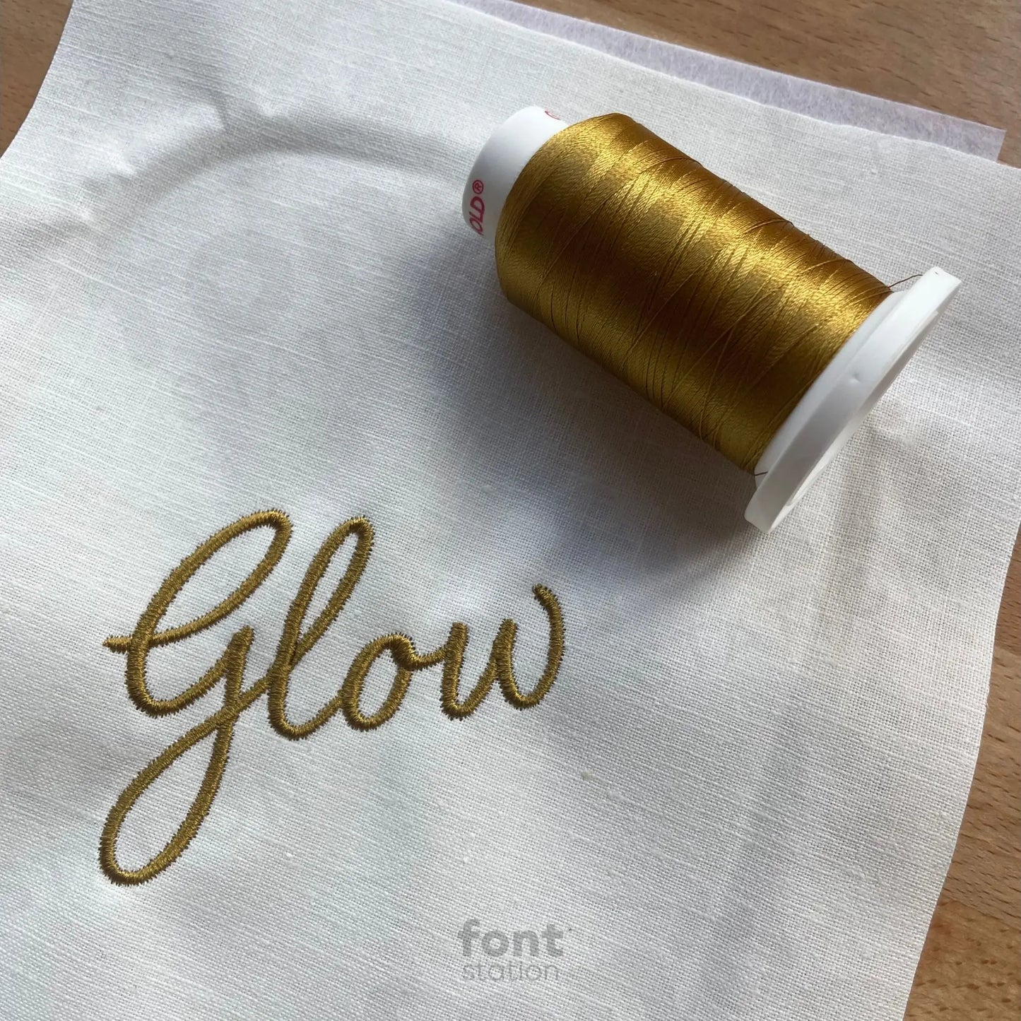 Image showing a word embroidered on textile using the Signature embroidery font created by FontStation
