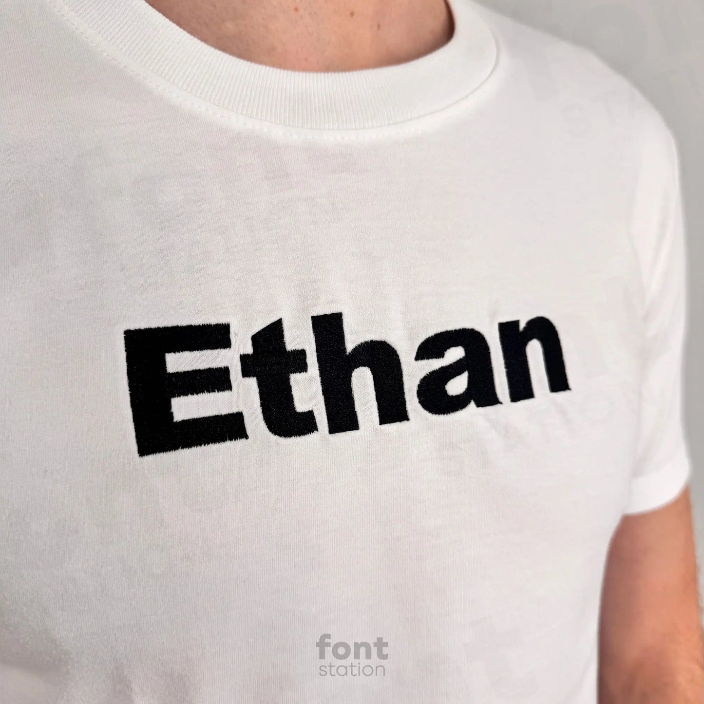 Image showing a word embroidered on textile using the Arial Black embroidery font created by FontStation