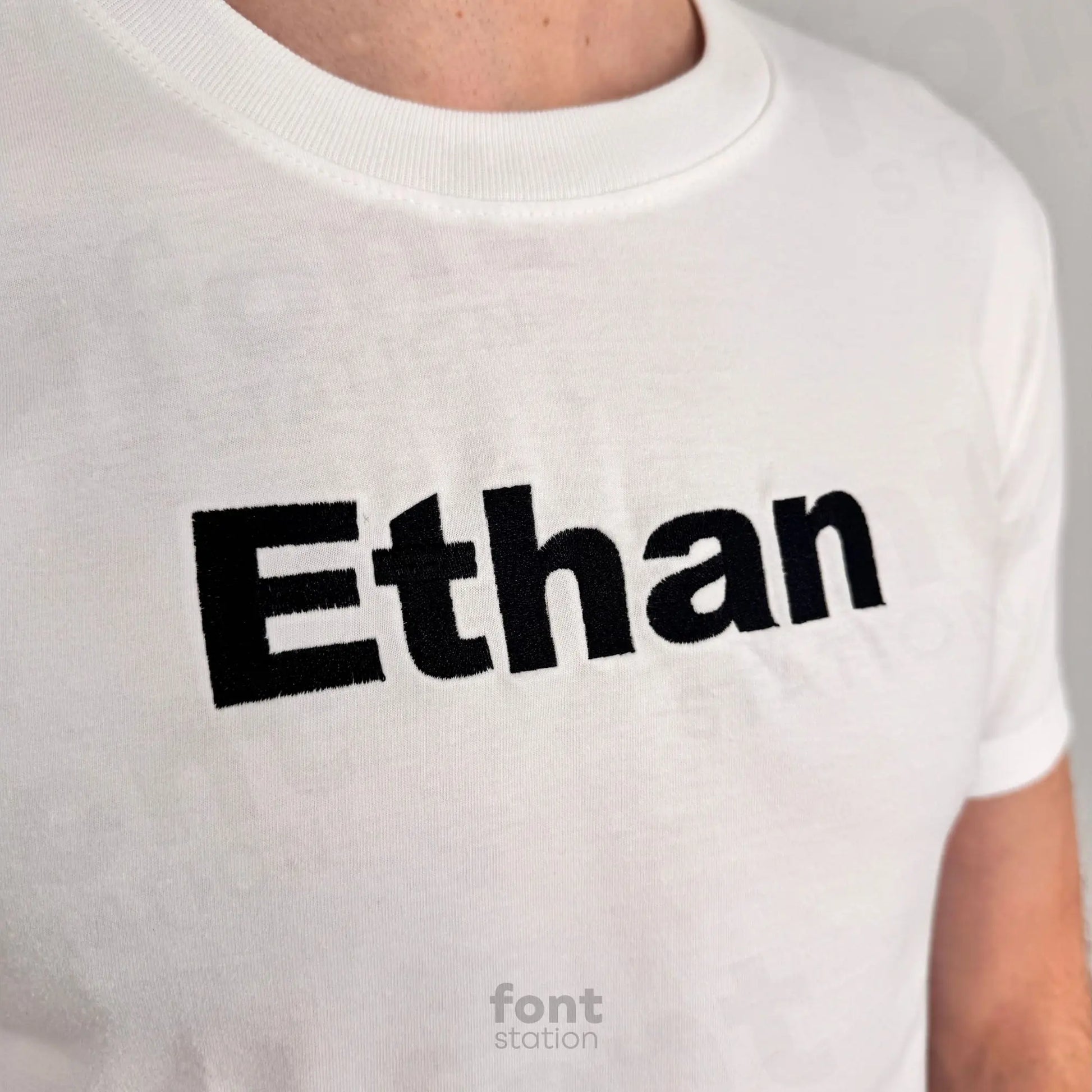 Image showing a word embroidered on textile using the Arial Black embroidery font created by FontStation
