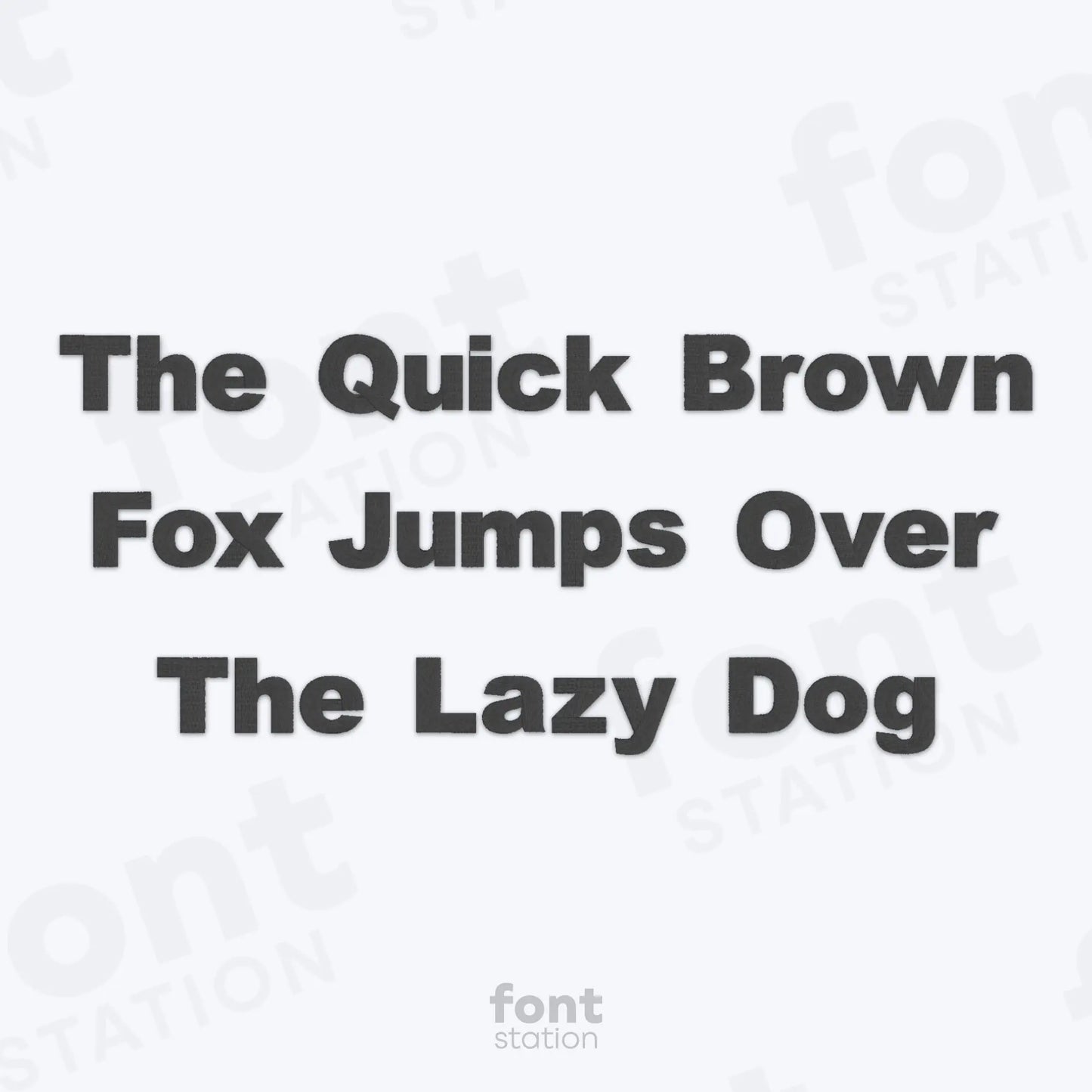 Text 'The Quick Brown Fox Jumps Over The Lazy Dog' on a white background using the Arial Black embroidery font by FontStation.