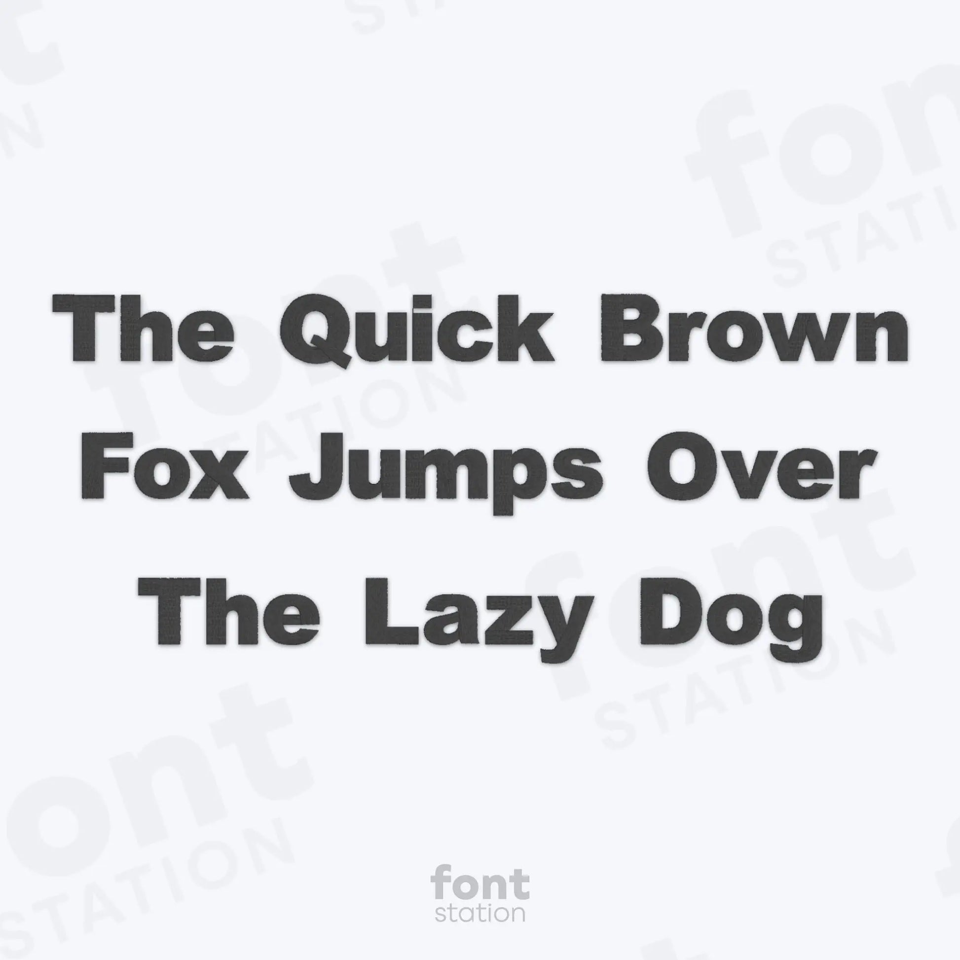 Text 'The Quick Brown Fox Jumps Over The Lazy Dog' on a white background using the Arial Black embroidery font by FontStation.