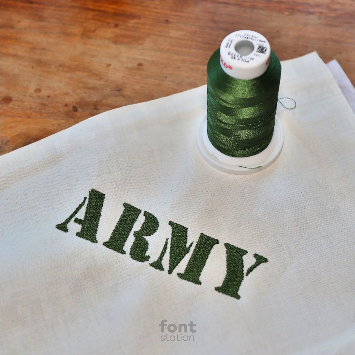 Image showing a word embroidered on textile using the Army embroidery font created by FontStation