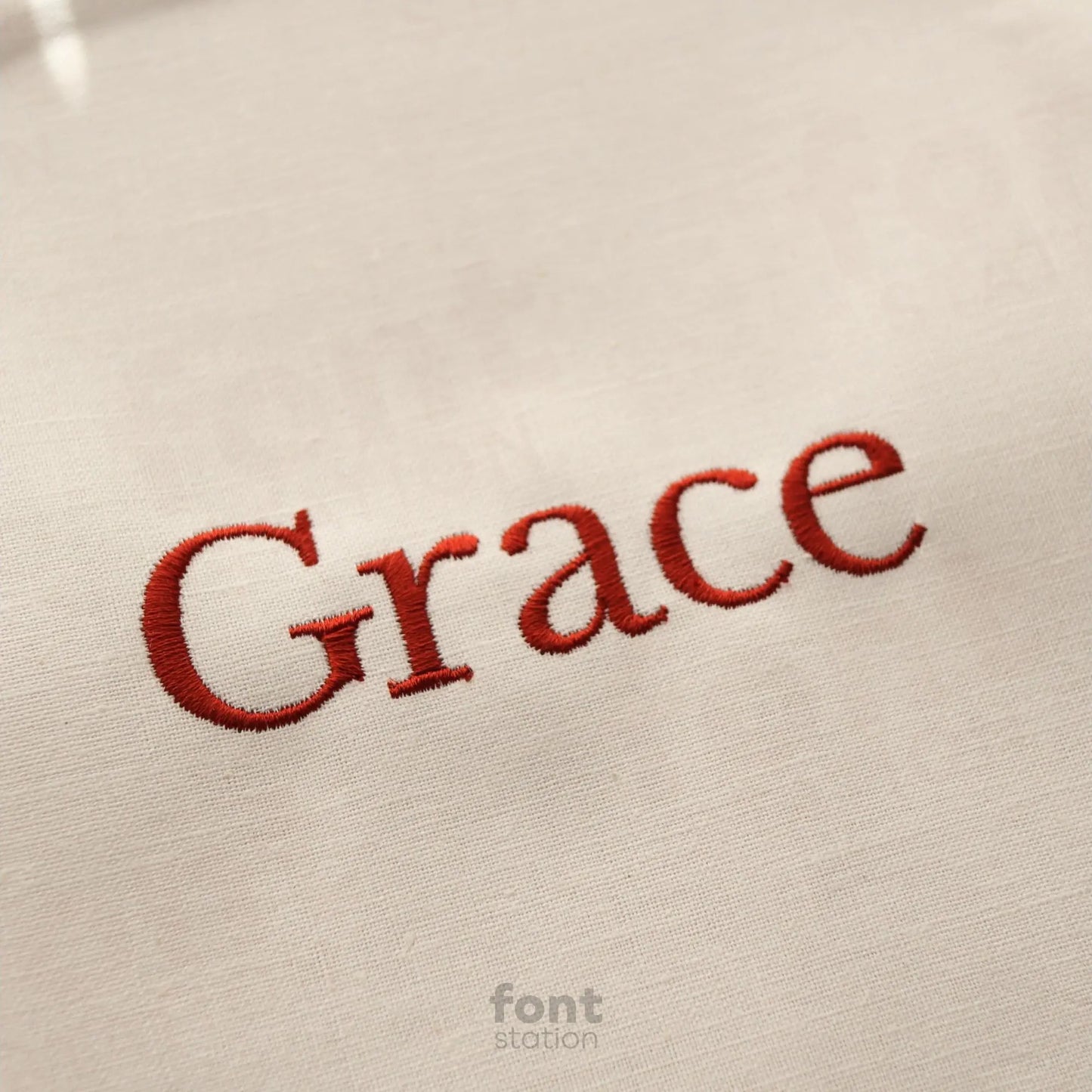 Image showing a word embroidered on textile using the Baskerville embroidery font created by FontStation