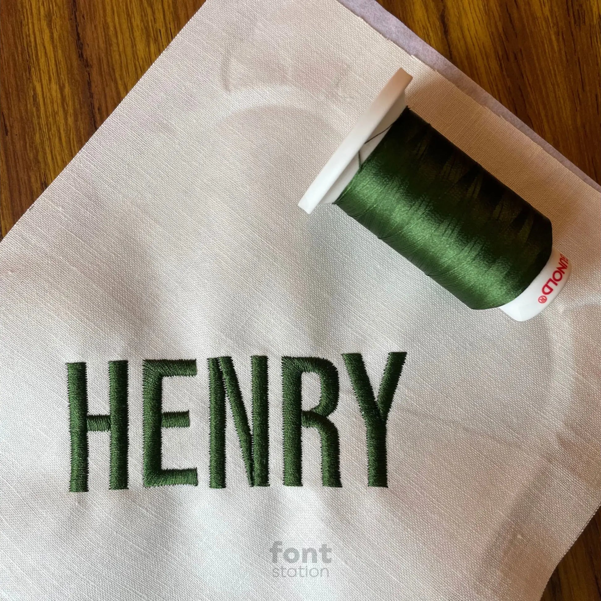 Image showing a word embroidered on textile using the Block embroidery font created by FontStation