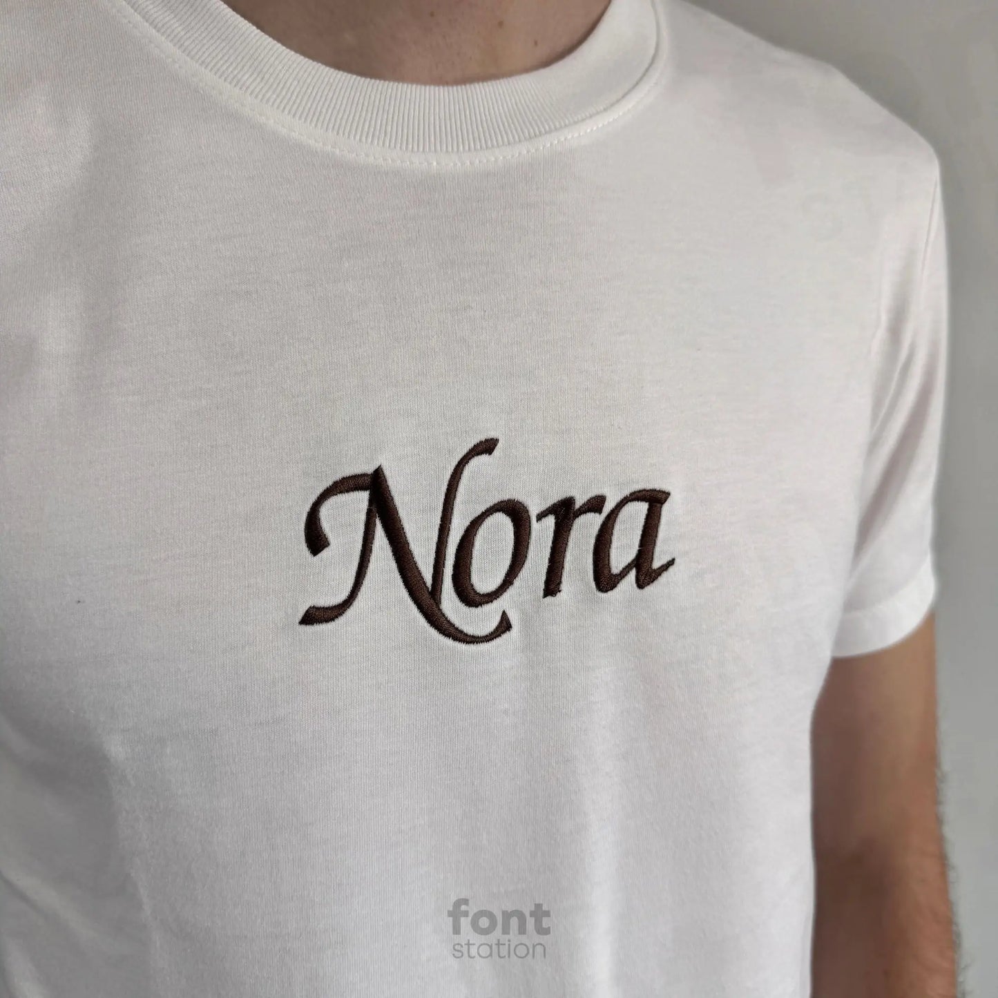 Image showing a word embroidered on textile using the Chancery embroidery font created by FontStation