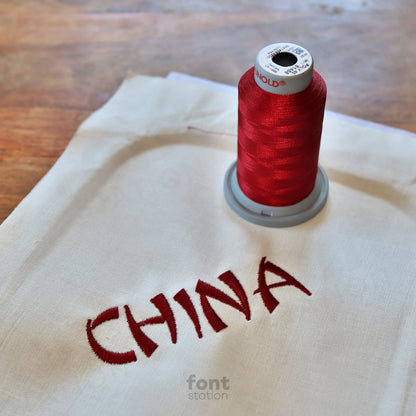 Image showing a word embroidered on textile using the Chinese embroidery font created by FontStation