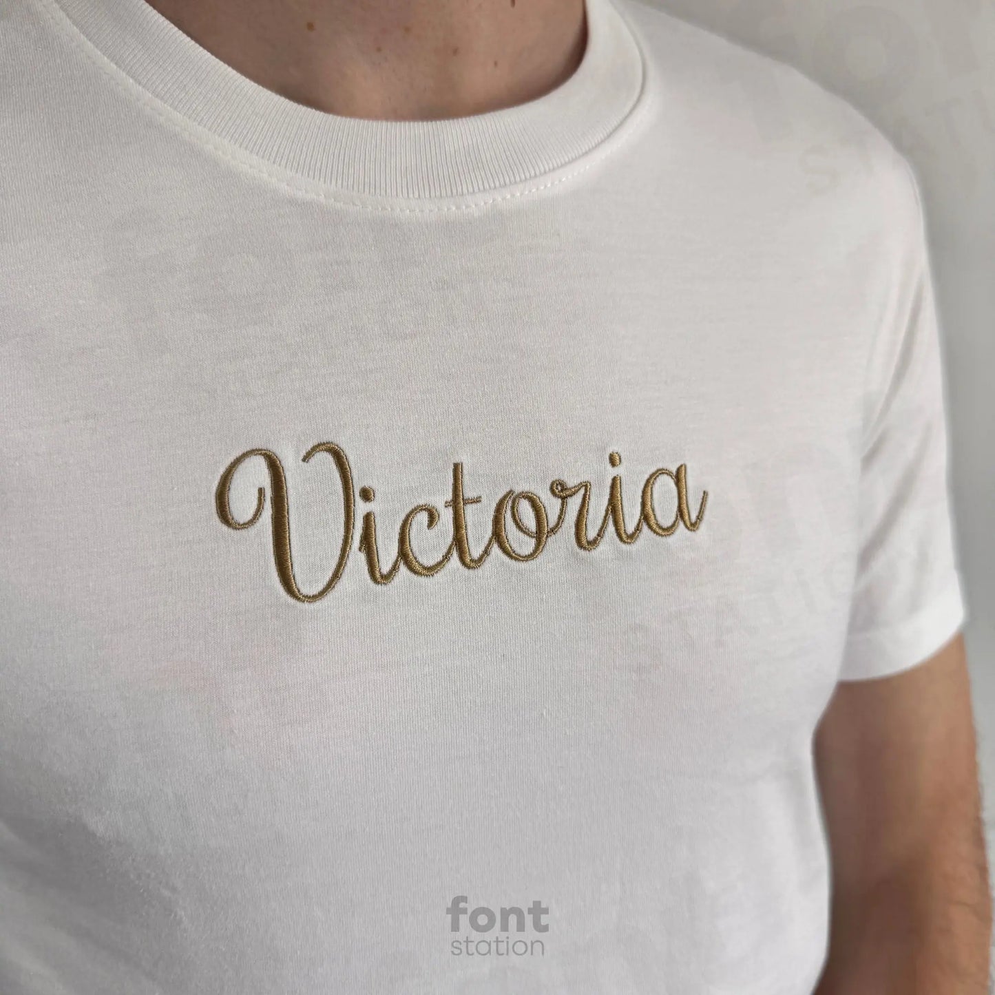 Image showing a word embroidered on textile using the Coquette embroidery font created by FontStation