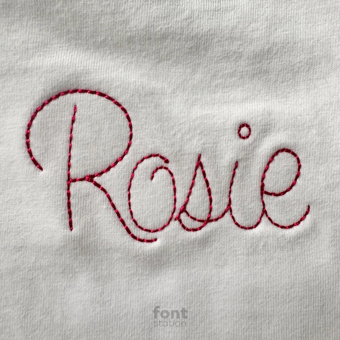 Image showing a word embroidered on textile using the Cursive Bean Stitch embroidery font created by FontStation