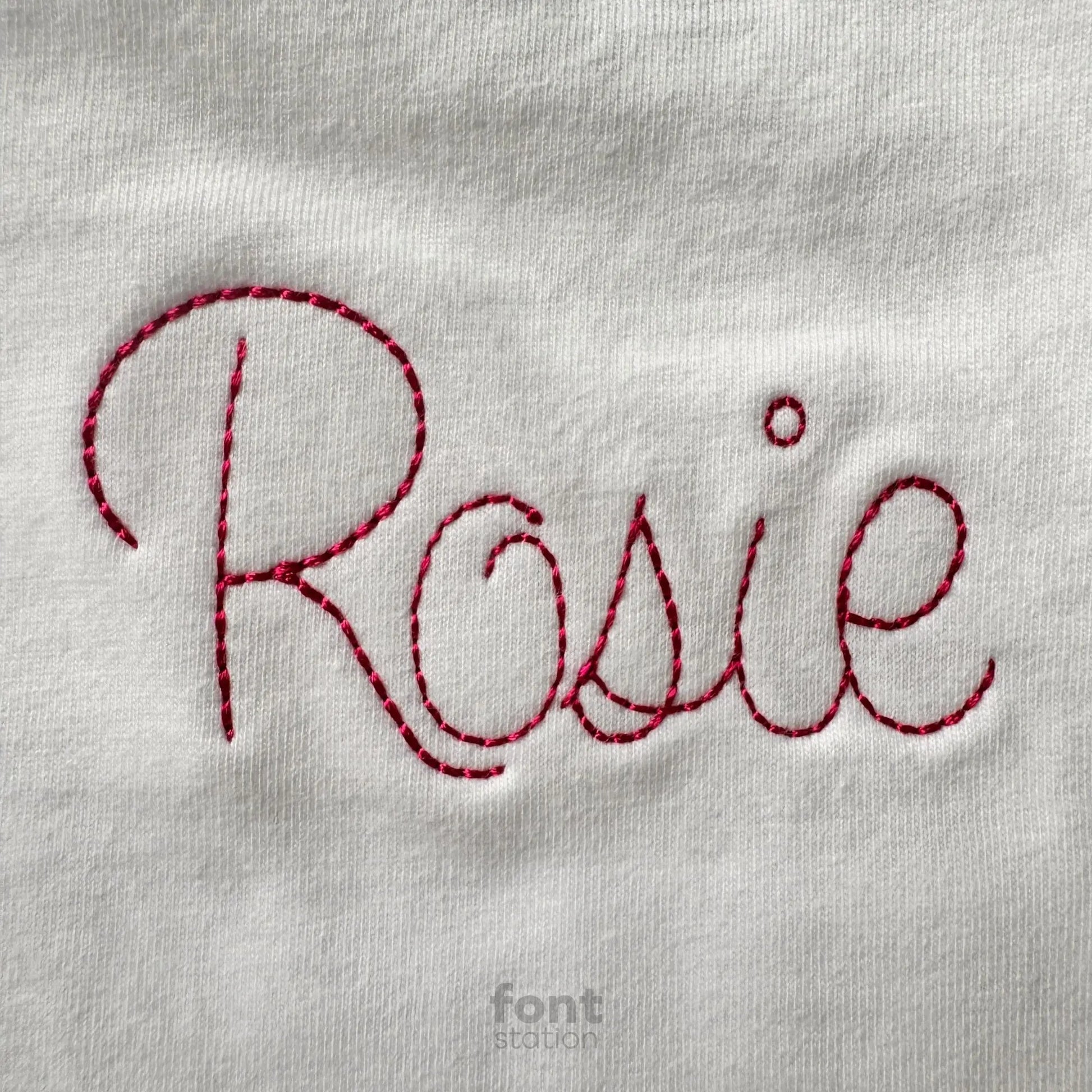 Image showing a word embroidered on textile using the Cursive Bean Stitch embroidery font created by FontStation