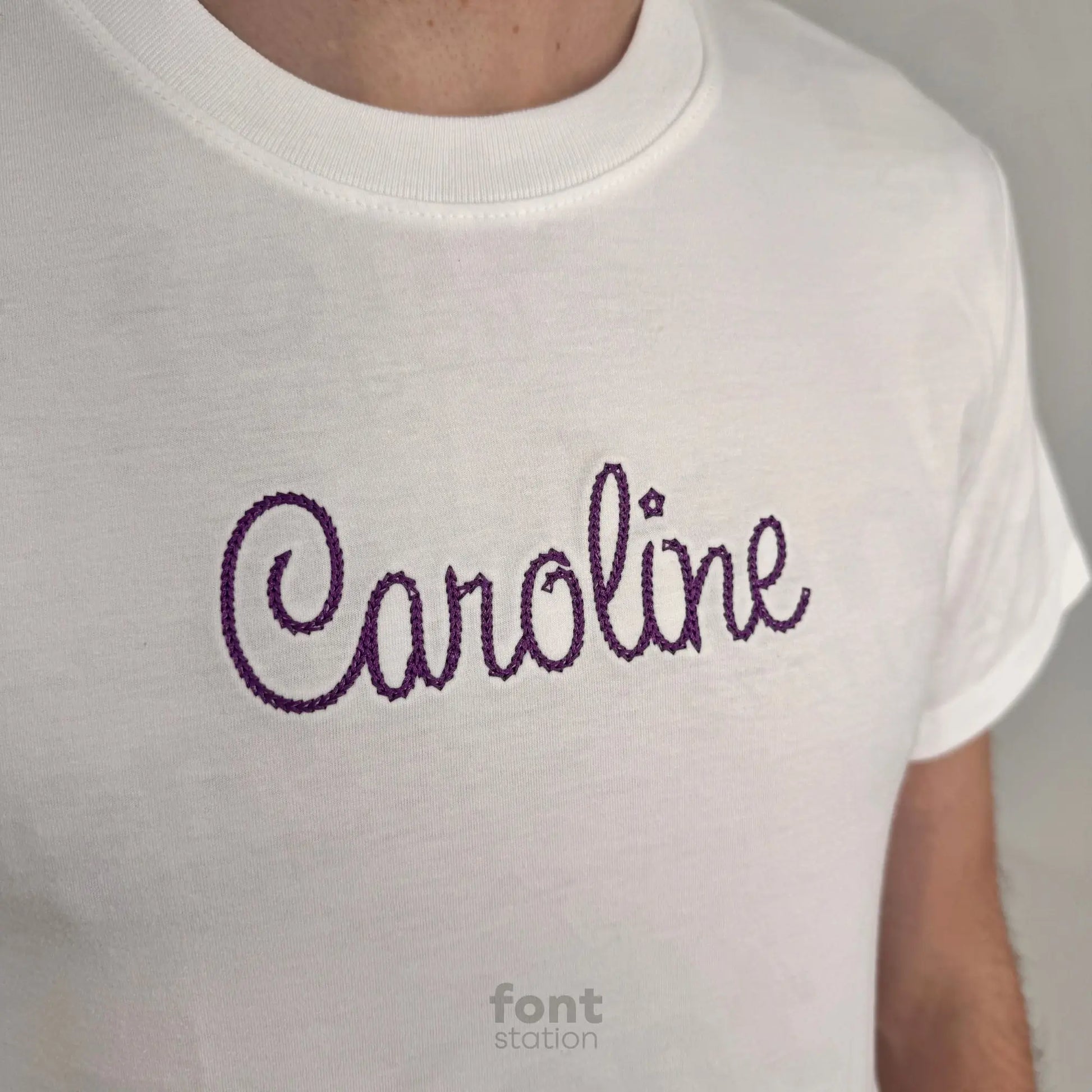 Image showing a word embroidered on textile using the Cursive Chain Stitch embroidery font created by FontStation