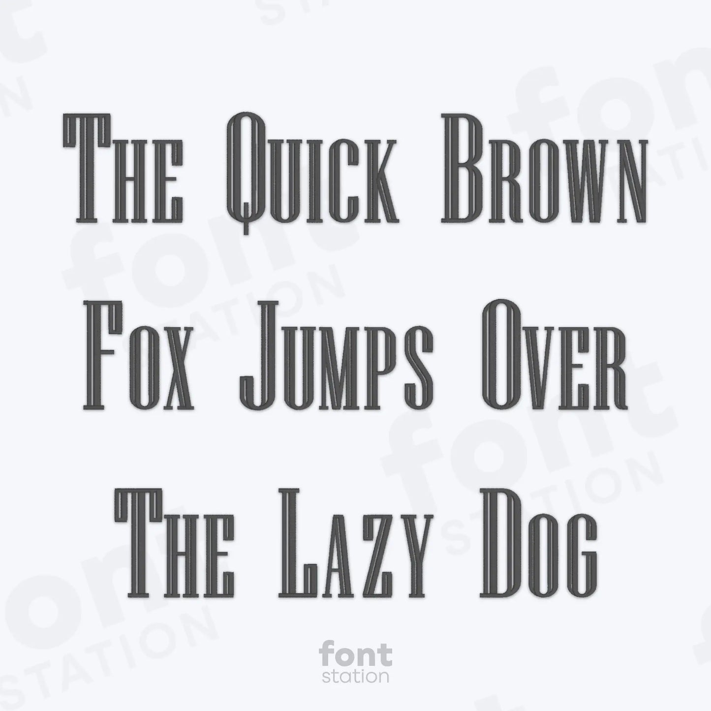Text phrase 'The Quick Brown Fox Jumps Over The Lazy Dog' on a white background using the Engraved embroidery font