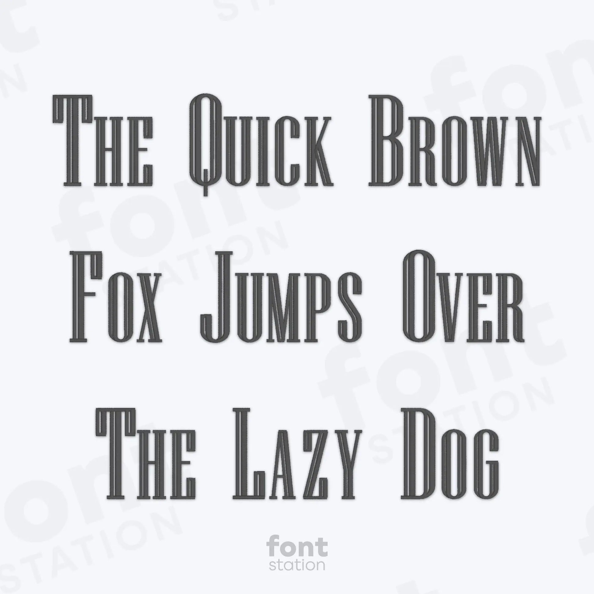 Text phrase 'The Quick Brown Fox Jumps Over The Lazy Dog' on a white background using the Engraved embroidery font