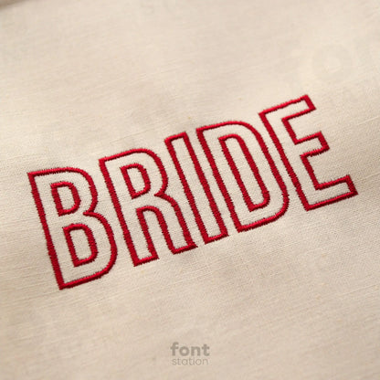 Image showing a word embroidered on textile using the Modern Outline embroidery font created by FontStation
