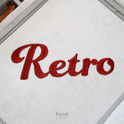 Image showing a word embroidered on textile using the Retro embroidery font created by FontStation