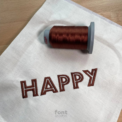 Image showing a word embroidered on textile using the Safari embroidery font created by FontStation