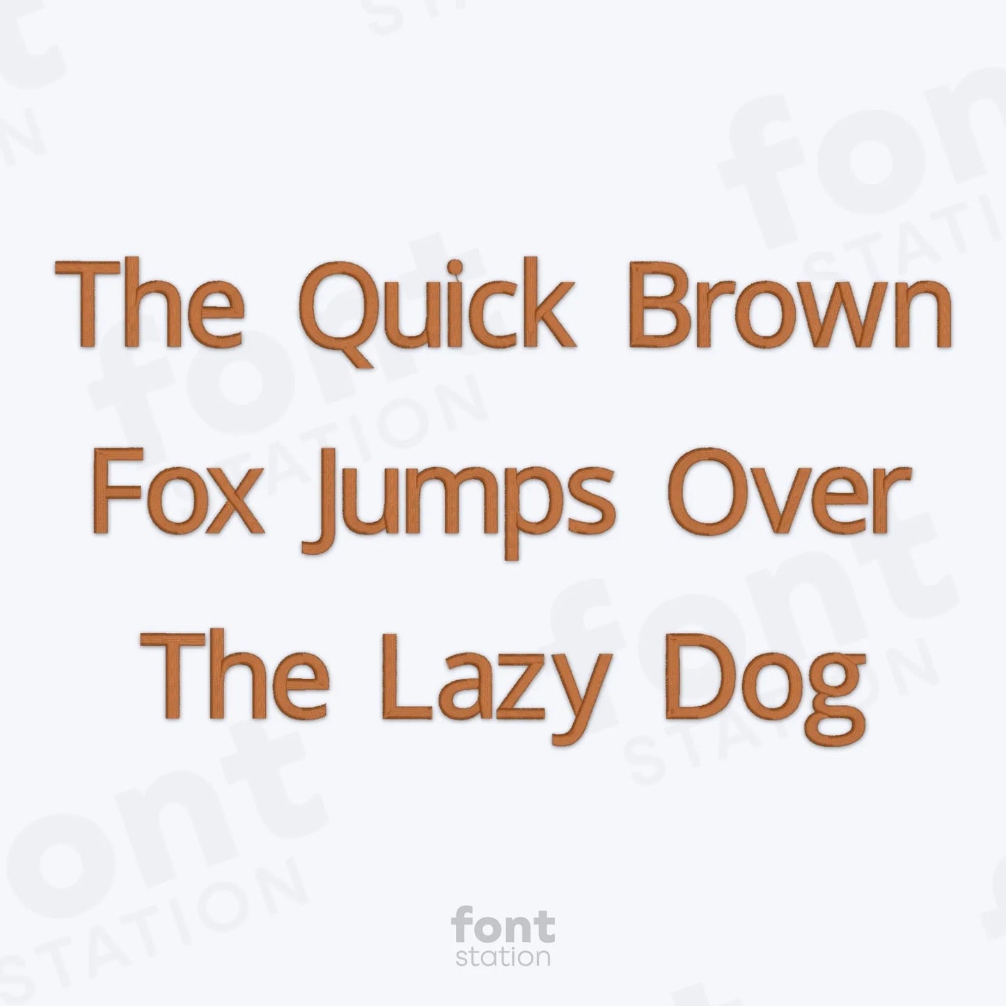 Text 'The Quick Brown Fox Jumps Over The Lazy Dog' on a white background using the Sans Serif embroidery font by FontStation