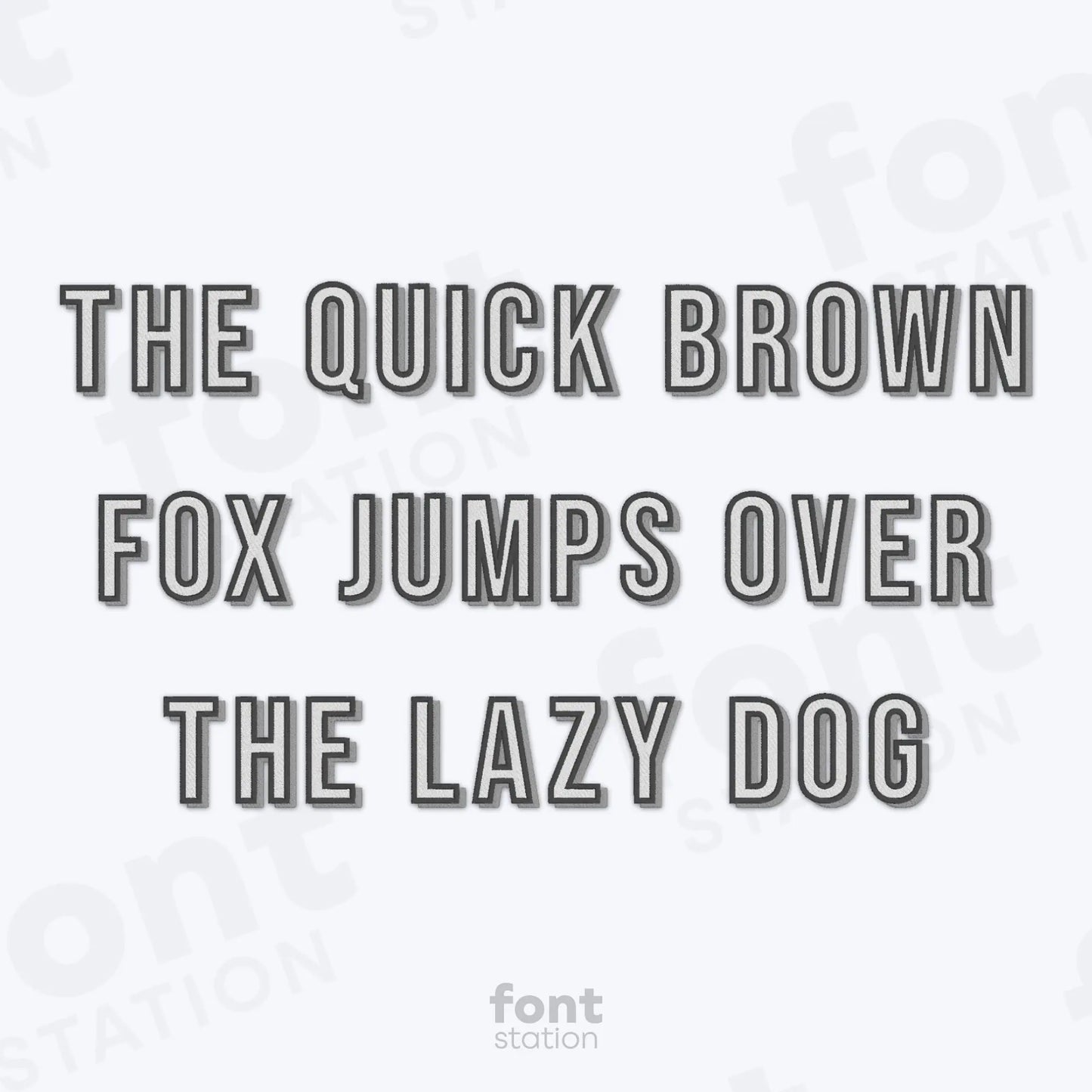 Text 'The quick brown fox jumps over the lazy dog' on a white background using the Shadow Block embroidery font by FontStation
