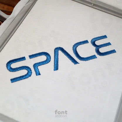 Embroidered letters using the Space embroidery font created by FontStation