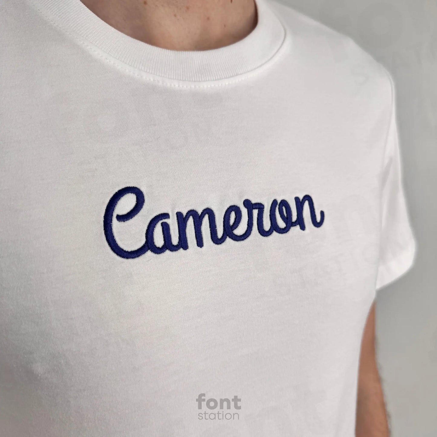Image showing a word embroidered on textile using the Thick Script embroidery font created by FontStation