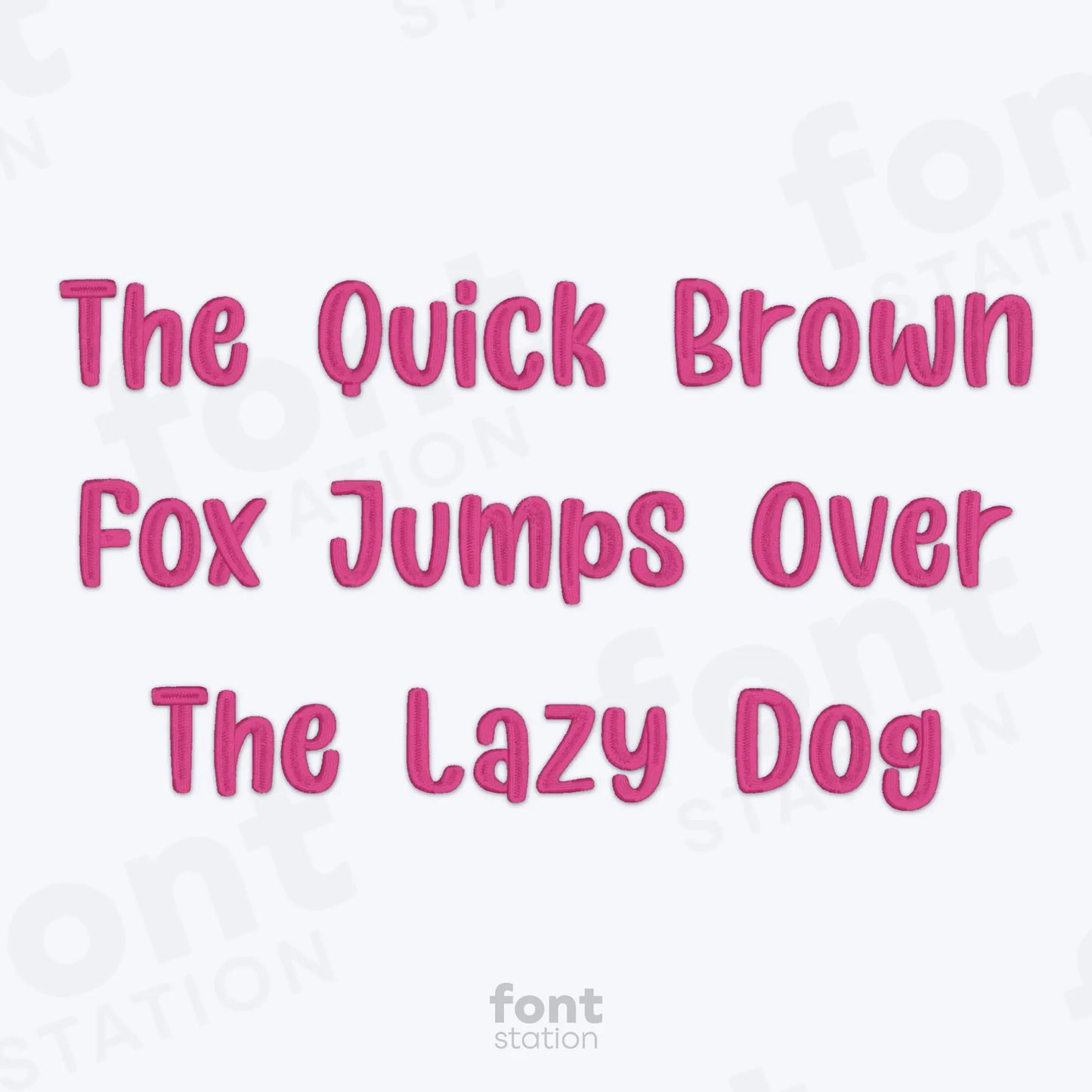 Text 'The Quick Brown Fox Jumps Over The Lazy Dog' using the Unicorn embroidery font in pink on a white background.