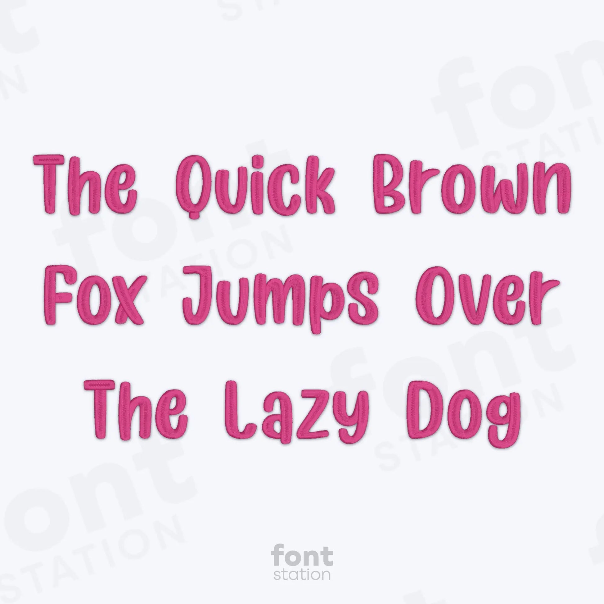 Text 'The Quick Brown Fox Jumps Over The Lazy Dog' using the Unicorn embroidery font in pink on a white background.