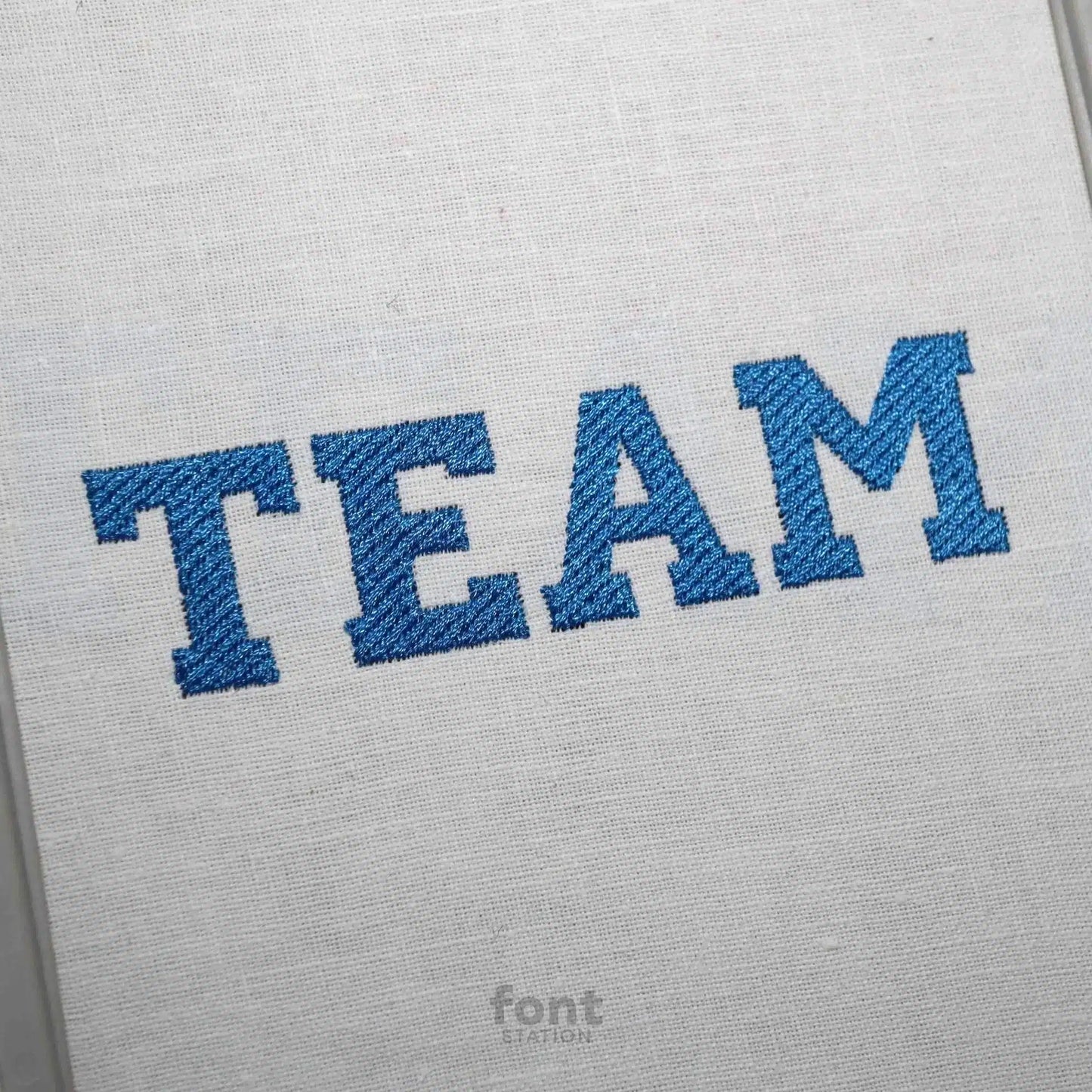 Image showing a word embroidered on textile using the Varsity embroidery font created by FontStation