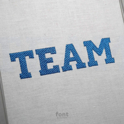 Image showing a word embroidered on textile using the Varsity embroidery font created by FontStation