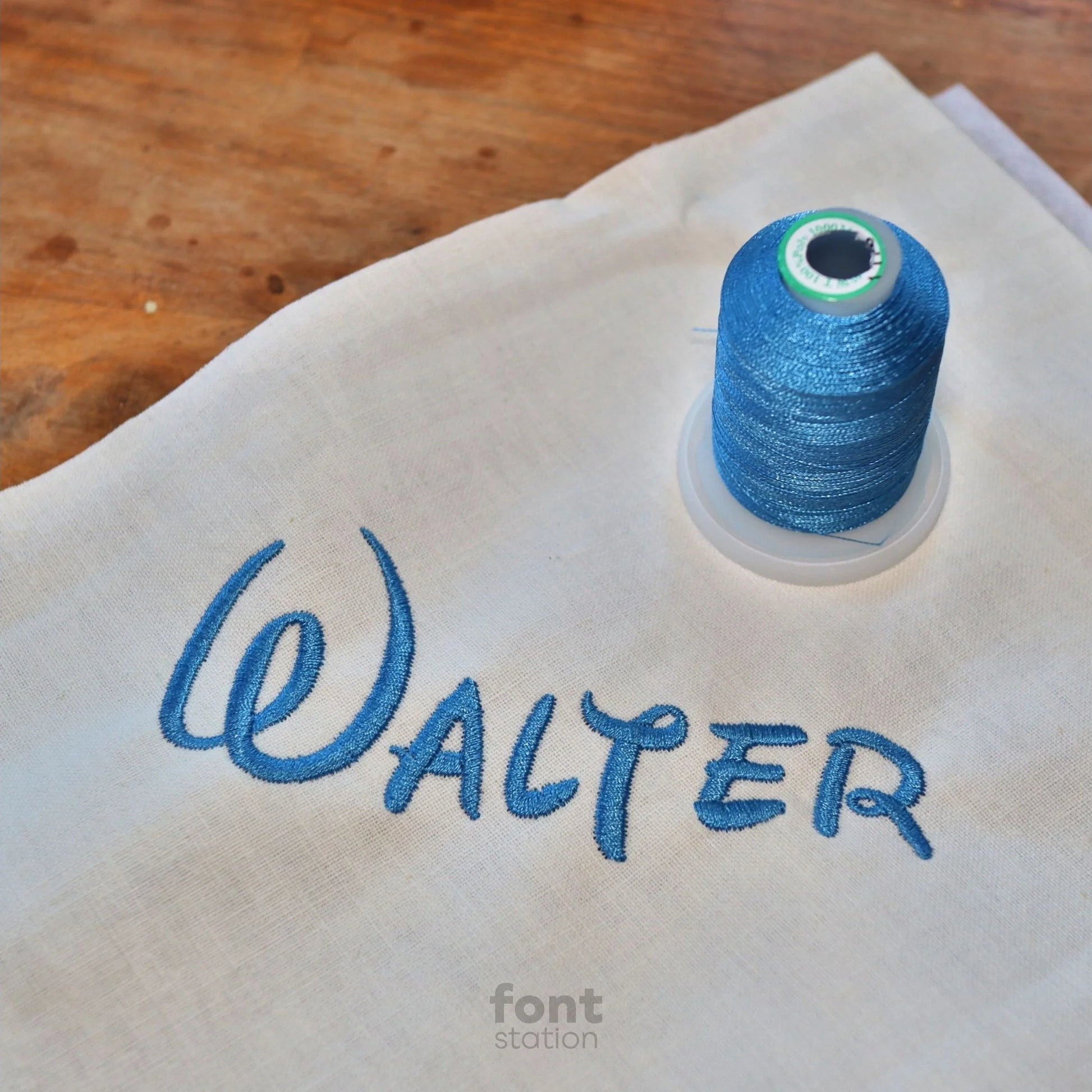 Image showing a word embroidered on textile using the Walter embroidery font created by FontStation