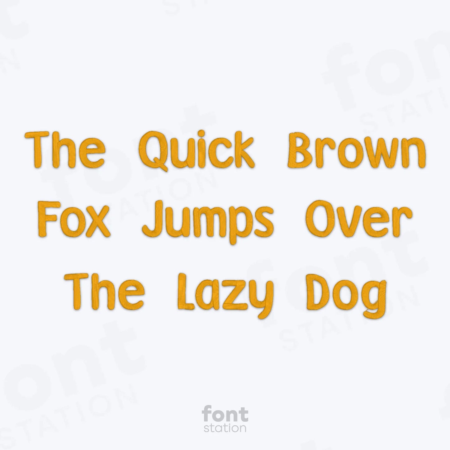 Text 'The Quick Brown Fox Jumps Over The Lazy Dog' using the Winnie embroidery font in yellow on a white background with 'font station' branding.