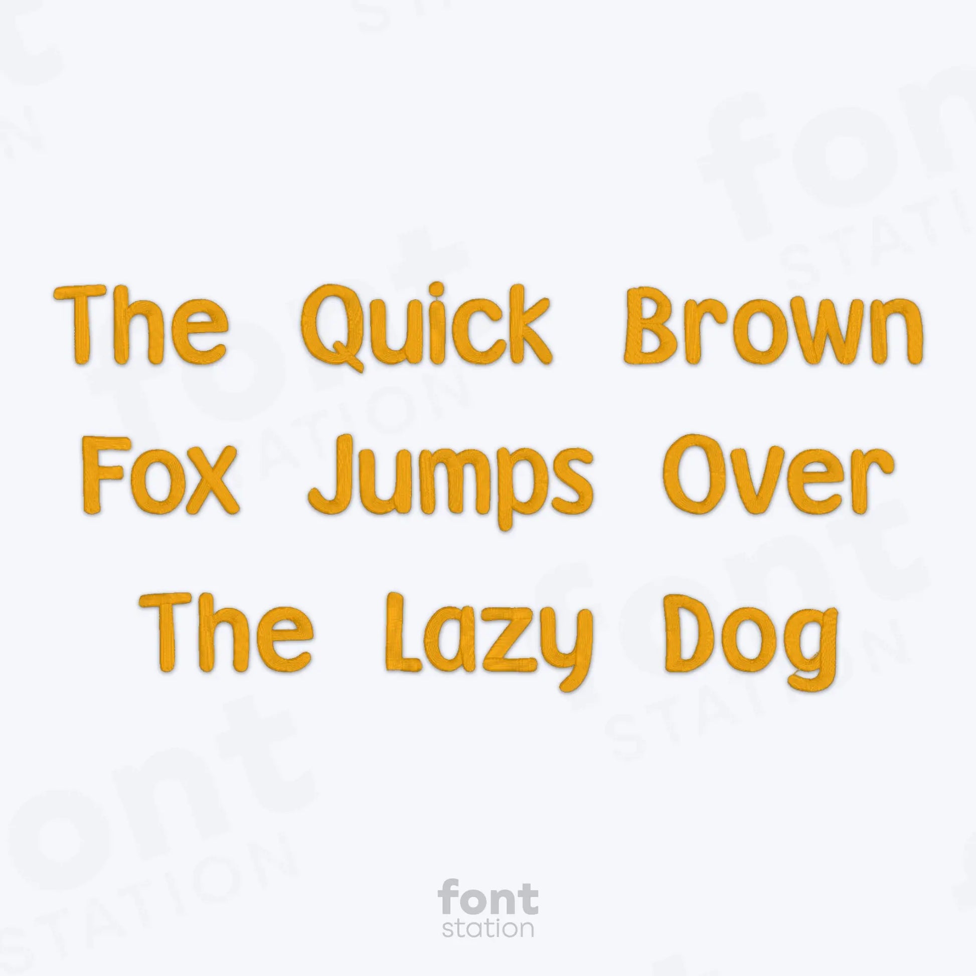 Text 'The Quick Brown Fox Jumps Over The Lazy Dog' using the Winnie embroidery font in yellow on a white background with 'font station' branding.